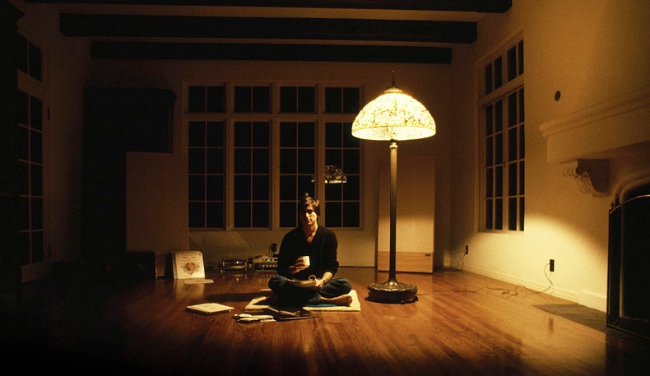 Steve Jobs, CEO of Apple, having a Zen moment at home in 1982
