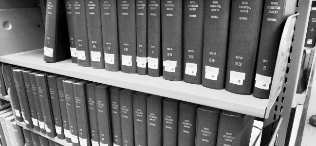 Academic journals on a shelf