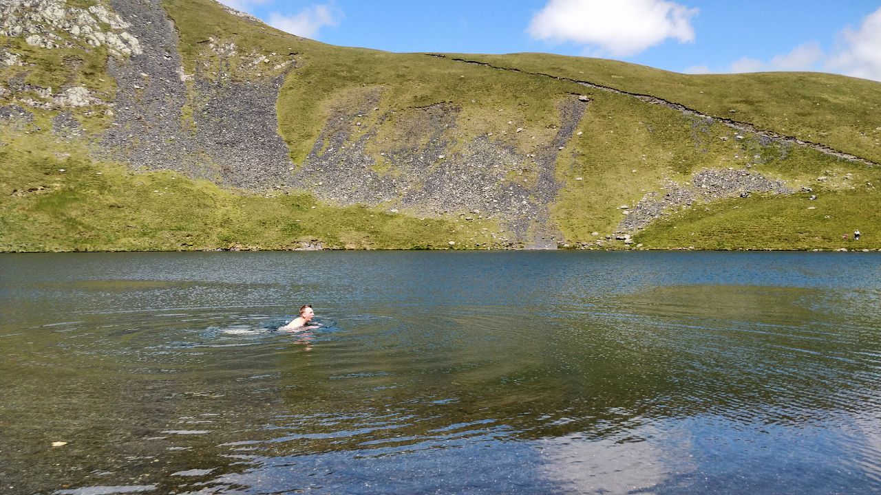 Tom swimming in Scales Tarn