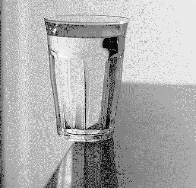 Dithered image of glass of water on edge of table
