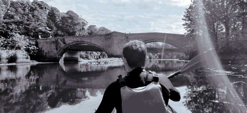 Paddling down the River Coquet