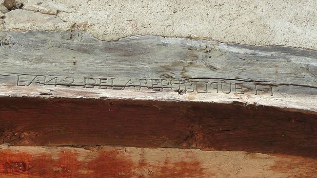 A French republican calendar date inscribed over the entrance to a barn in France (Mury), near Geneva. Inscription reads: L AN 2 DE LA REPUBLIQUE FR. (Year 2 of the French Republic). 1793 or 1794.