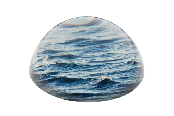 Glass paperweight with image of waves within it