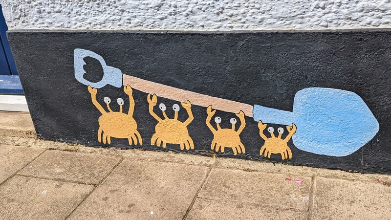 Mural of crabs holding a spade
