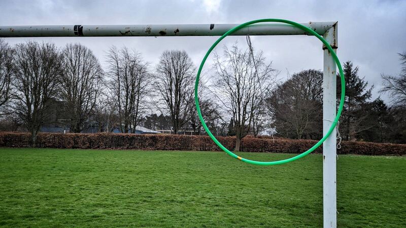 Hoop tied onto football goalposts in top right-hand corner