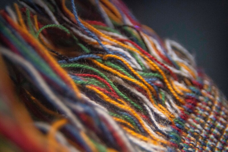 Colourful threads being woven