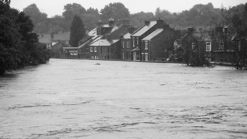 Black and white cropped version of a photo by Flickr user johndal showing Morpeth floods in 2008