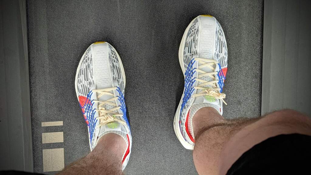 Doug's new trainers with his legs and feet in them on the treadmill