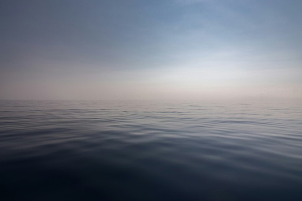 A photograph of the vast, seemingly endless ocean, and sky.