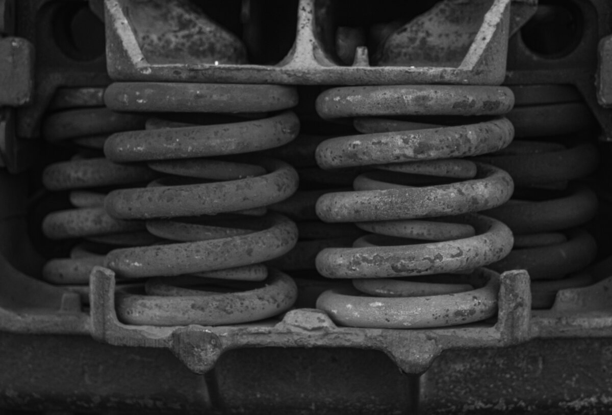 Heavy duty shock absorbers. Black and white photograph.